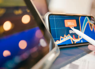 Trader examining Bitcoin, Ethereum, and foreign exchange options across multiple markets