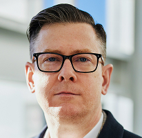 Crypto trading company executive Alexander Hughes in a CEO portrait